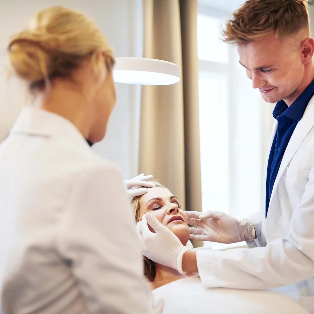 two-doctors-discussing-cosmetic-surgery-options-ov-4MVJKD9.jpg two-doctors-discussing-cosmetic-surgery-options-ov-4MVJKD9.jpg